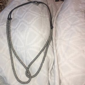 black rope necklace with silver rimming